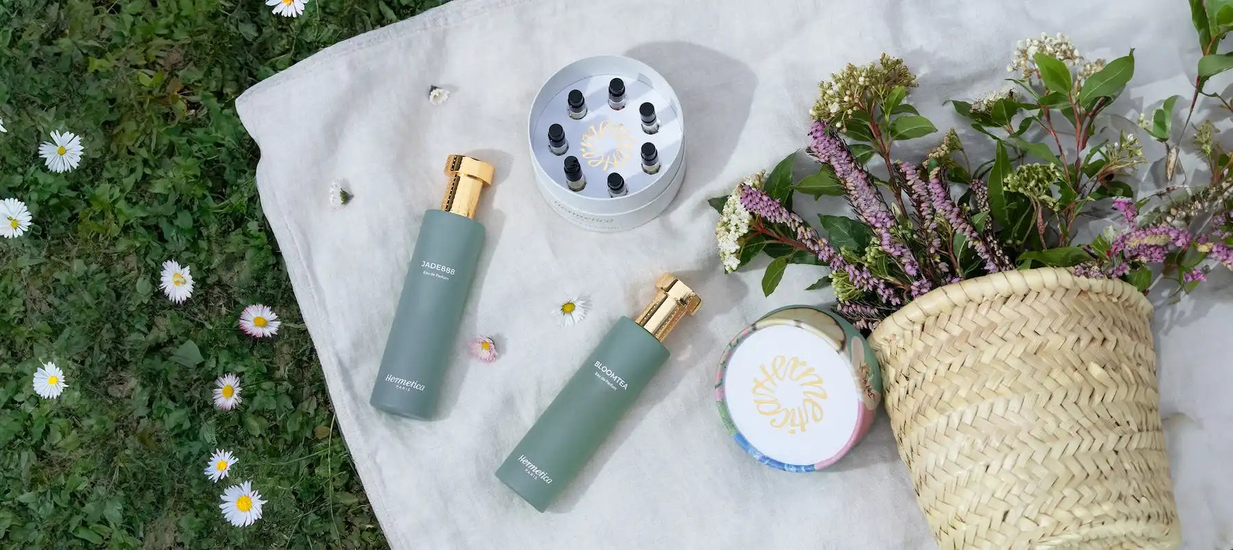 Green cosmetic spray bottles with gold caps.