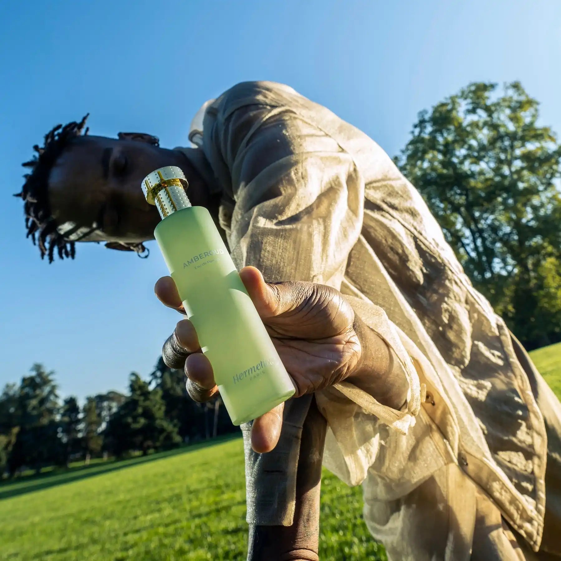 Light green reusable water bottle with a silver cap.
