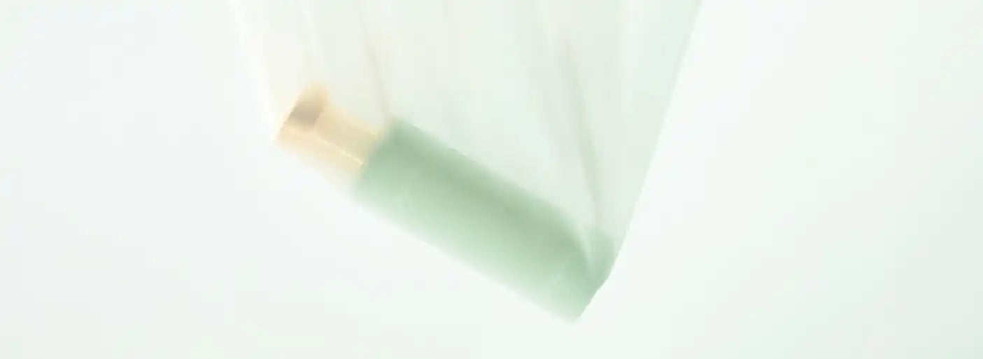 Partially used eraser with a worn edge.