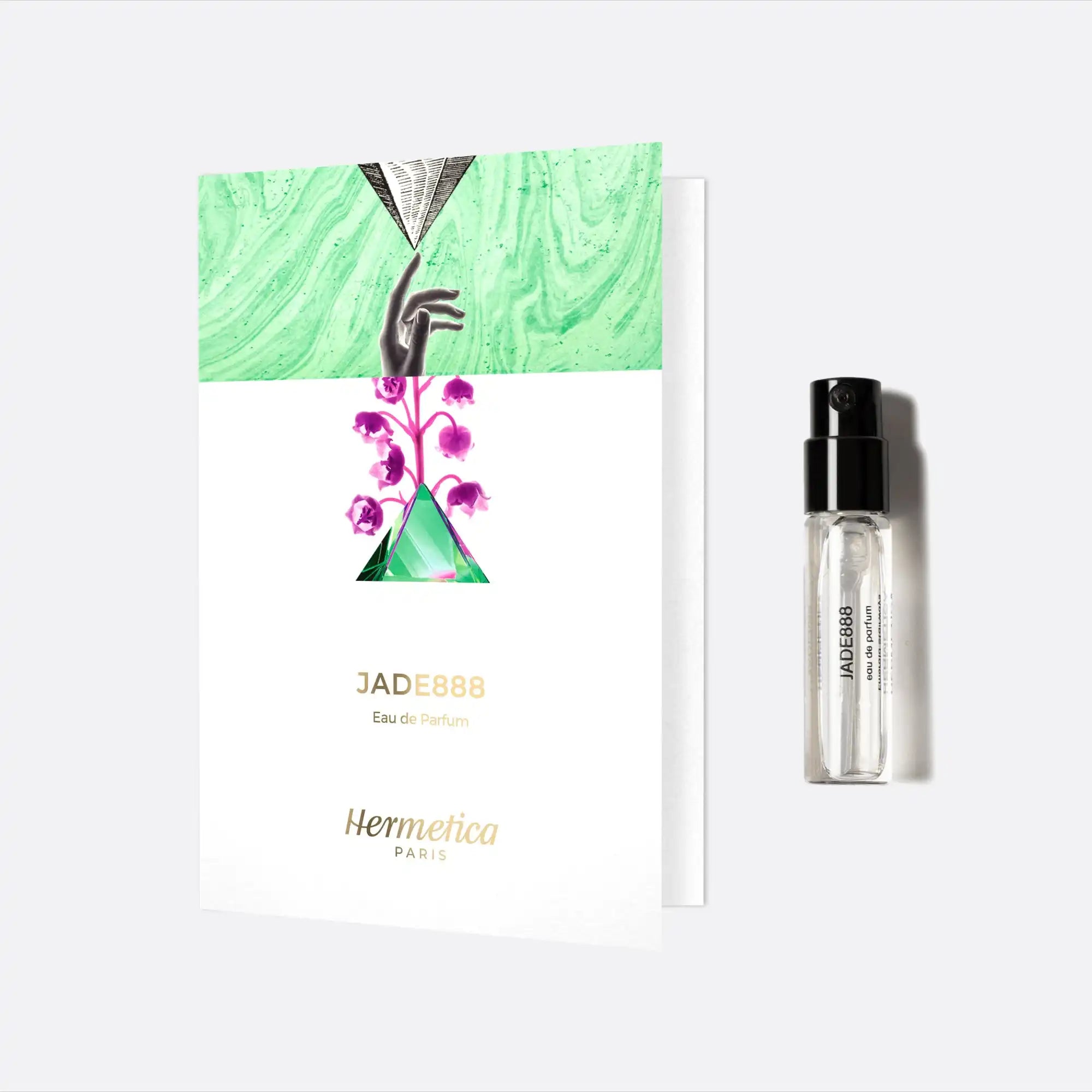 Perfume sample vial next to a product card with green and purple floral artwork.